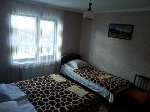 Letto o letti in una camera di Guest House Sunset
