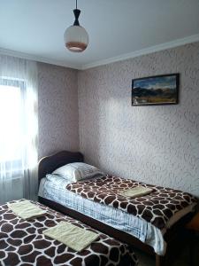 Letto o letti in una camera di Guest House Sunset