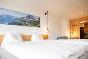 Ein Bett oder Betten in einem Zimmer der Unterkunft Hotel Tödiblick