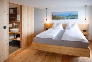 Postel nebo postele na pokoji v ubytování Hotel Tödiblick
