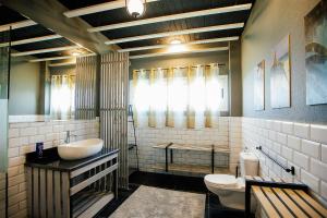 a bathroom with a sink and a toilet at Egyptian Style 5 STAR Villa for Friends and Family Gatherings in 6th Of October +74 photos