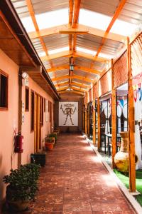 a hallway of a building with a ceiling at Hostal Tulvak Atacama in San Pedro de Atacama