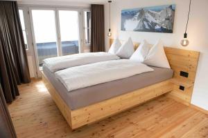 Ein Bett oder Betten in einem Zimmer der Unterkunft Hotel Tödiblick