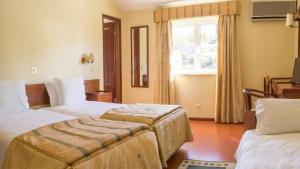 Cama ou camas em um quarto em Hotel Belsol