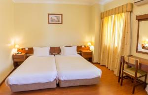 Cama ou camas em um quarto em Hotel Belsol