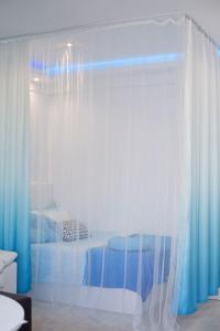 A bed or beds in a room at Apartamento Séptimo cielo primera línea de mar
