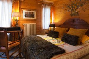 Postel nebo postele na pokoji v ubytování Chalet-Hôtel & Spa Les Cimes