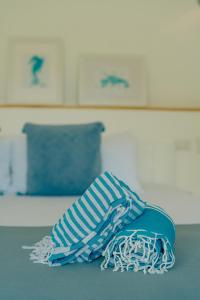 Letto o letti in una camera di PUNTA POPY Boutique HOTEL