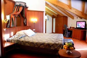 Postel nebo postele na pokoji v ubytování Sartori's Hotel