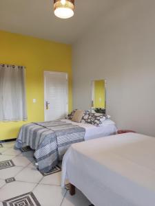 Cama o camas de una habitación en Flor Amarela