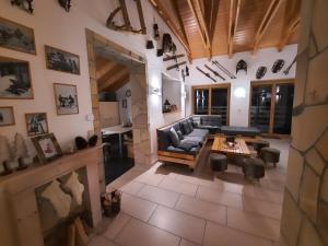 a living room with a couch and a table at APARTMENT PRIVAT LUNA - Vysoké Tatry in Nová Lesná