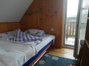 Dulakówka - domek na każdą pogodę 객실 침대