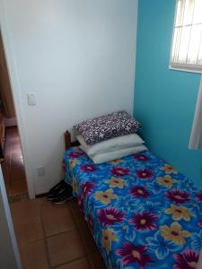 En eller flere senge i et værelse på Cantinho do sossego