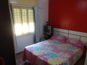 En eller flere senge i et værelse på Cantinho do sossego + 18 billeder