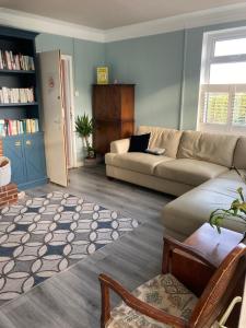 a living room with a couch and a table at Overdale Motel in Lisburn