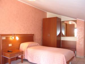 Ένα ή περισσότερα κρεβάτια σε δωμάτιο στο B&B il Tulipano