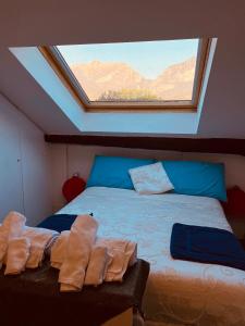 a bedroom with a bed with two towels on it at Lecco Centro 1 in Lecco