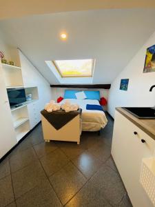 a small bedroom with a bed and a skylight at Lecco Centro 1 in Lecco