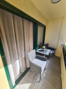 a room with a table and chairs and a window at CARPE DIEM in Puerto de la Cruz