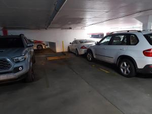 a group of cars parked in a parking garage at Coral Beach Isla Verde Beach Front Large 1 Bedroom Apt 208 Tower 1 in San Juan