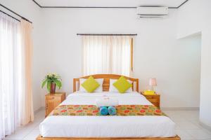 מיטה או מיטות בחדר ב-The Bingin Green View by Bukit Vista