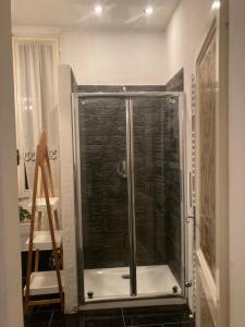 a shower with a glass door in a bathroom at Casa vacanza sole lago… in Intra +10 photos