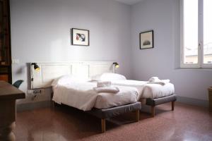 Ein Bett oder Betten in einem Zimmer der Unterkunft Vicolo Folletto Home