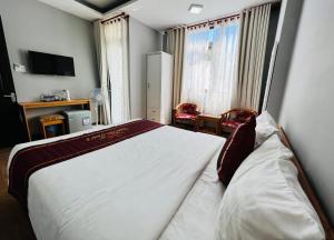 Postel nebo postele na pokoji v ubytování Dalat ECO Hotel 2
