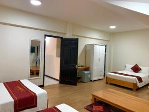Postel nebo postele na pokoji v ubytování Dalat ECO Hotel 2