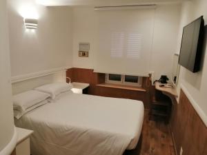 Posteľ alebo postele v izbe v ubytovaní Hotel Verona Rome