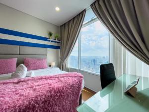 Postel nebo postele na pokoji v ubytování Vortex KLCC Suites by Homestay