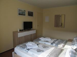 Ein Bett oder Betten in einem Zimmer der Unterkunft Hotel Landhaus Nassau