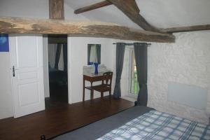 Postel nebo postele na pokoji v ubytování L'Ancienne Cave