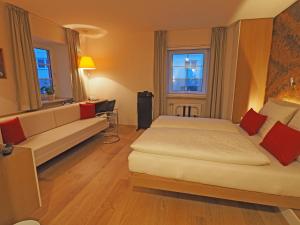 Tempat tidur dalam kamar di Hotel Schlair