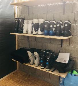 a bunch of boots on shelves in a room at Zimmervermietung Ackersand in Stalden