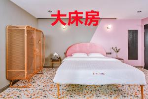 Postel nebo postele na pokoji v ubytování 仙本那爱丽家民宿Elly's Home