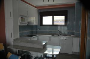 Kuchyňa alebo kuchynka v ubytovaní Apartamentos Turisticos Vilagarcía- Rio Ulla