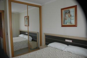 Posteľ alebo postele v izbe v ubytovaní Apartamentos Turisticos Vilagarcía- Rio Ulla