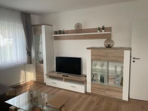 a living room with a flat screen tv at Gemütliche Dachgeschosswohnung in Aßlar