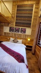 מיטה או מיטות בחדר ב-Dang Khoa Homestay
