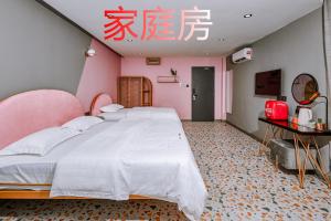 Postel nebo postele na pokoji v ubytování 仙本那爱丽家民宿Elly's Home