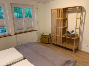 a bedroom with a bed and a book shelf at Ferienwohnungen Bohner/Wohnung Elisabeth in Meersburg