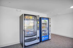 two vending machines are standing next to each other at The Avalon Club in Clearwater Beach