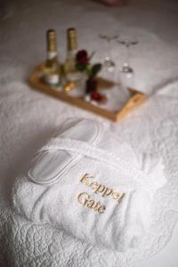 a towel with the words recycle club on a table at Keppel Gate B&B - Silver Birch Ensuite Room in Overseal