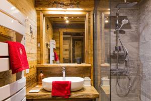 a bathroom with a sink and a shower at ski au pied, 3ch 2Sdb Garage Terrasse in Courchevel +61 photos