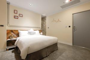 Llit o llits en una habitació de Napas Hotel