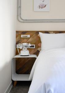 Llit o llits en una habitació de Napas Hotel