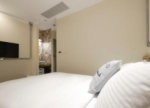Llit o llits en una habitació de Napas Hotel