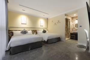Llit o llits en una habitació de Napas Hotel