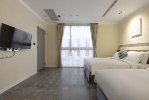 Llit o llits en una habitació de Napas Hotel